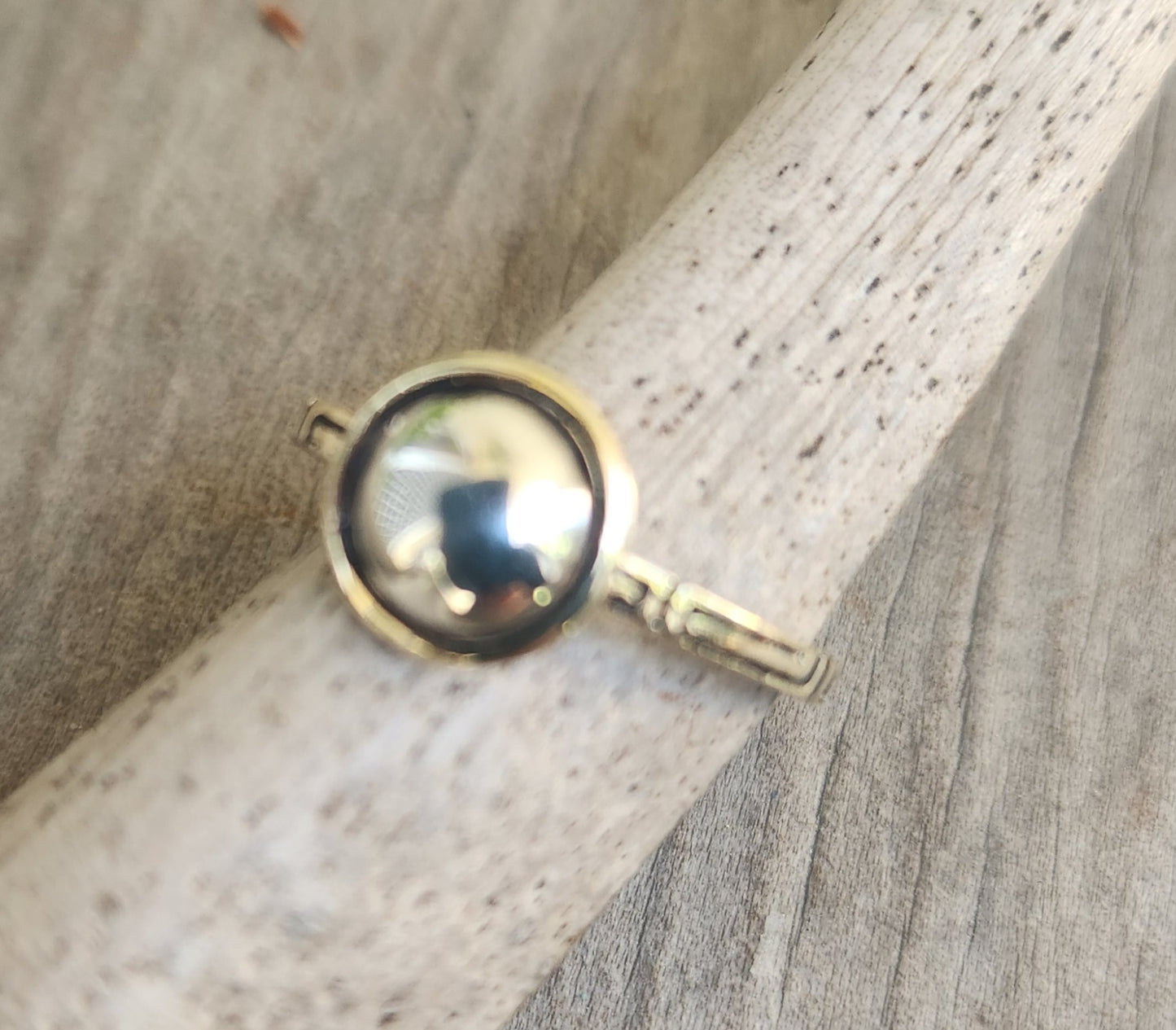 Two tone pinkie ring,9k gold with a sterling silver dome.