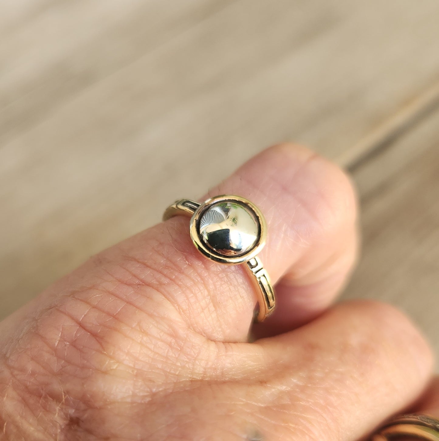 Two tone pinkie ring,9k gold with a sterling silver dome.