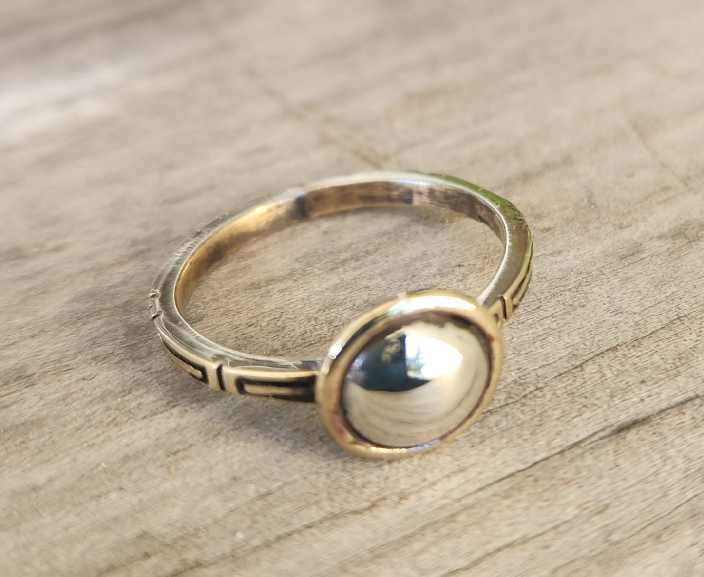 Two tone pinkie ring,9k gold with a sterling silver dome.