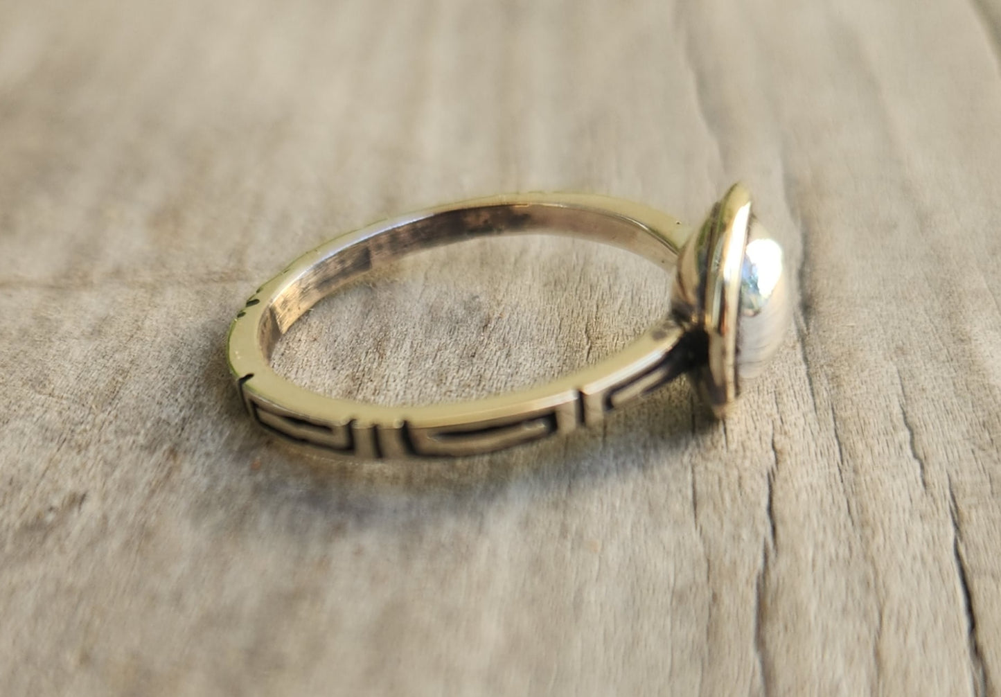 Two tone pinkie ring,9k gold with a sterling silver dome.