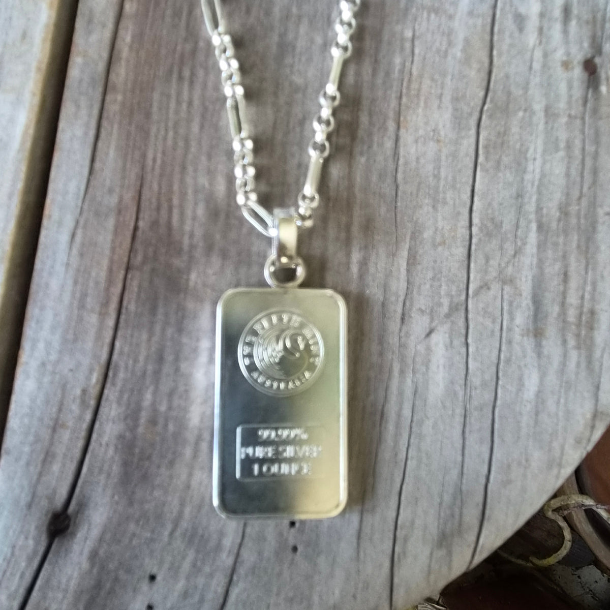 Dragon pendant,1 troy onze bullion bar.99.9 percent silver.Perth mint Australia