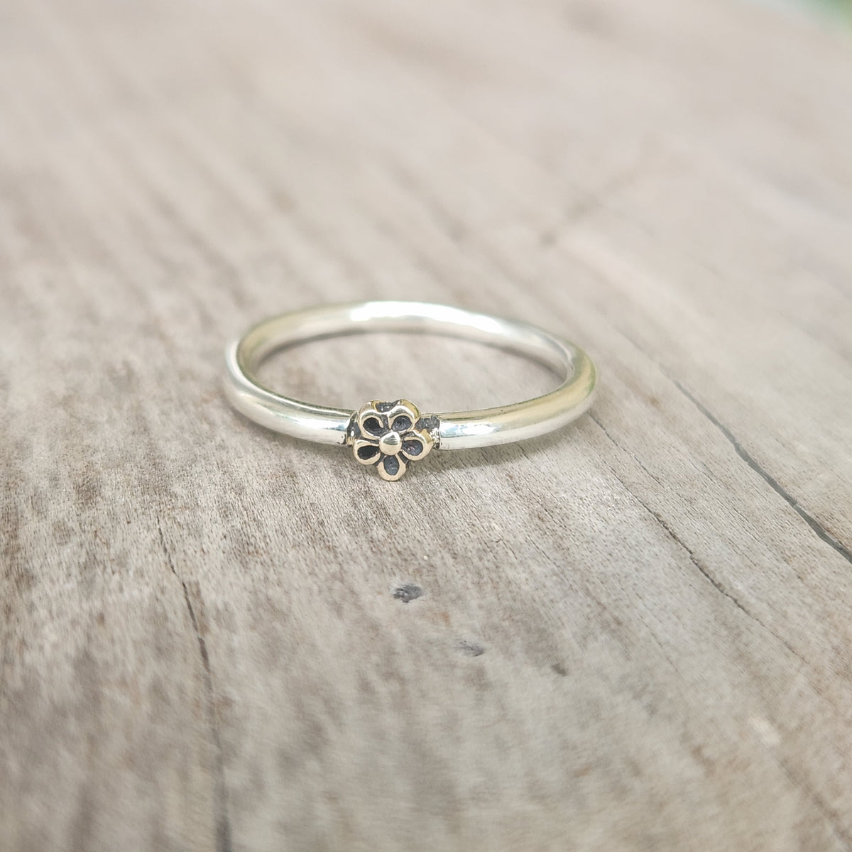 Two tone ring.9k gold flower on sterling silver band. Dainty mixed metal ring