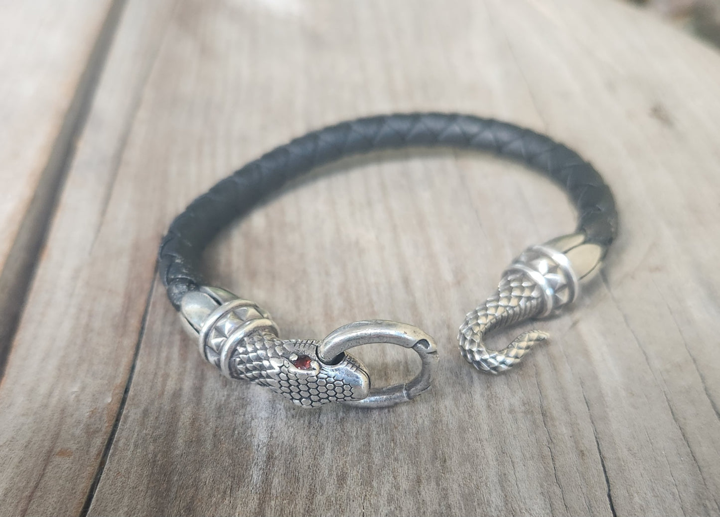 Silver snake and leather bracelet,925 sterling silver,22gms heavy solid,red eyes