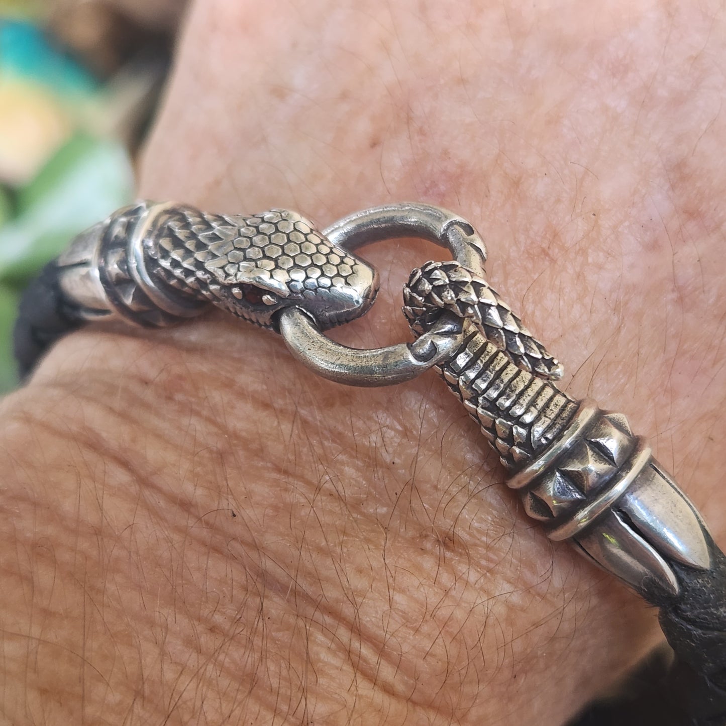Silver snake and leather bracelet,925 sterling silver,22gms heavy solid,red eyes