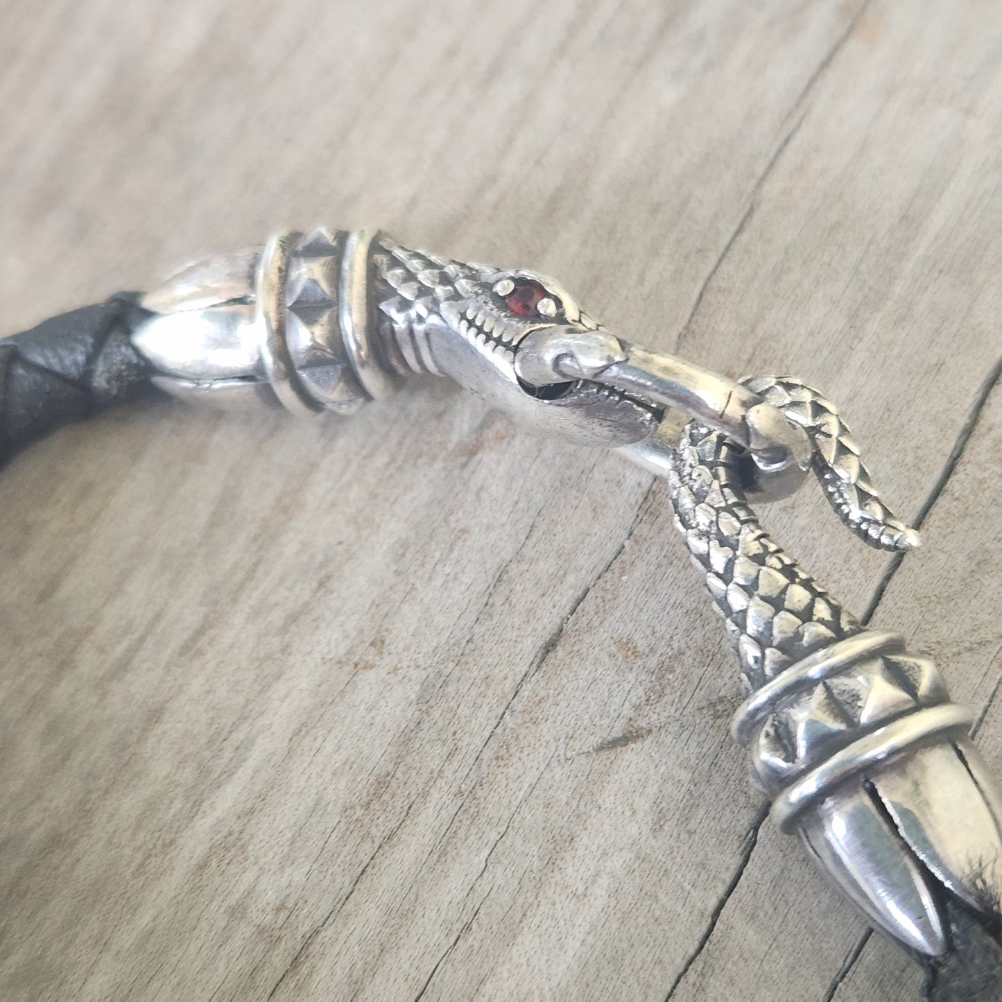 Silver snake and leather bracelet,925 sterling silver,22gms heavy solid,red eyes