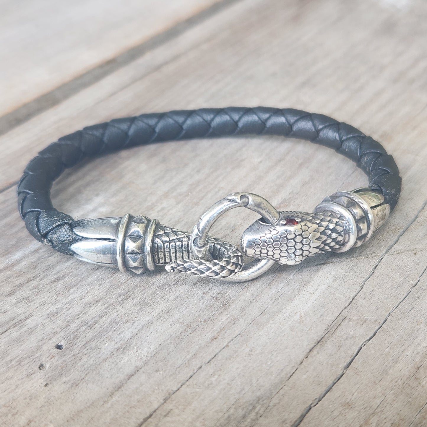 Silver snake and leather bracelet,925 sterling silver,22gms heavy solid,red eyes