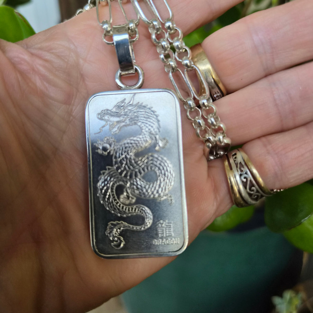 Dragon pendant,1 troy onze bullion bar.99.9 percent silver.Perth mint Australia