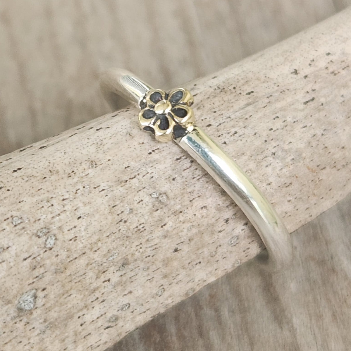 Two tone ring.9k gold flower on sterling silver band. Dainty mixed metal ring