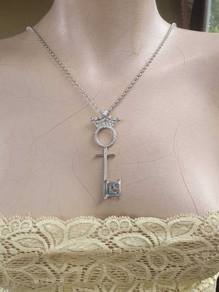 Penthouse pet key pendant,vintage,1990s,brass,gold colour